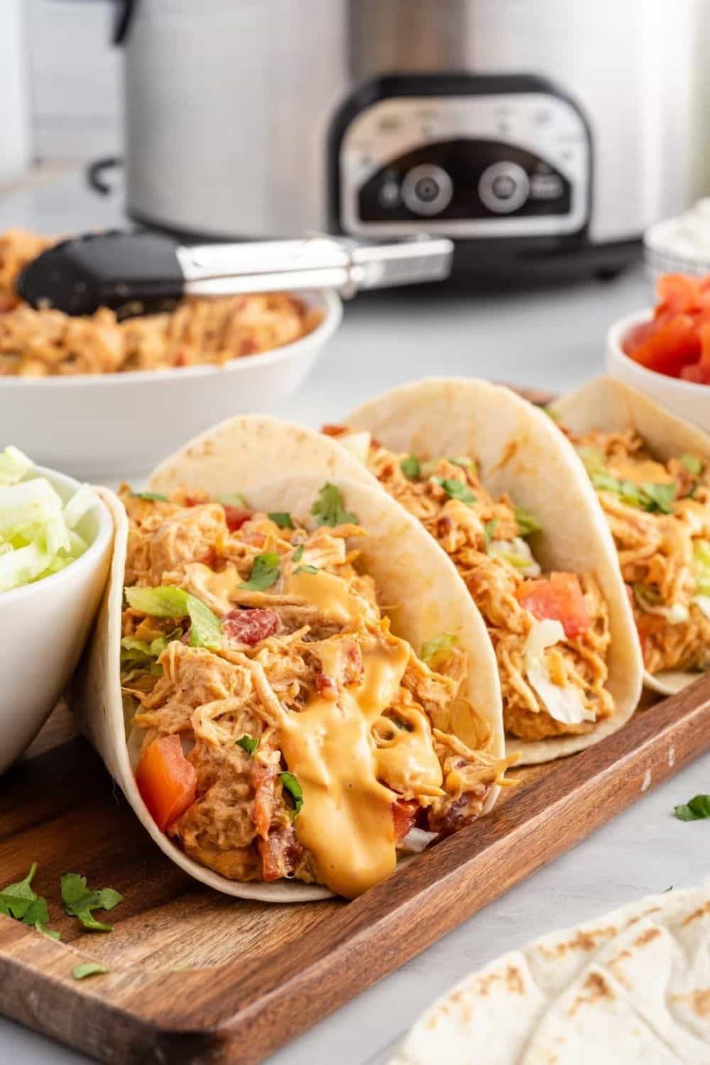 Slow Cooker Queso Chicken Tacos